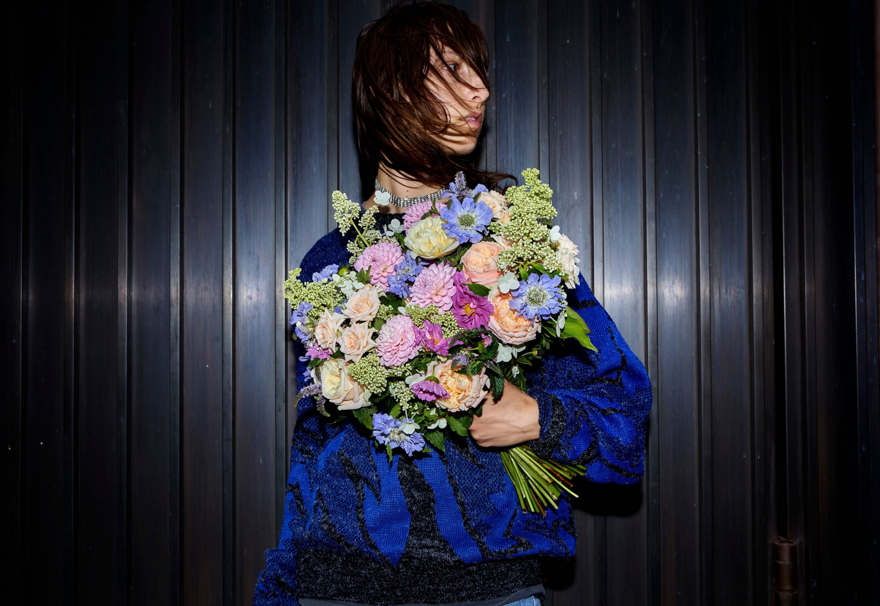 girl holding a flower bouquet