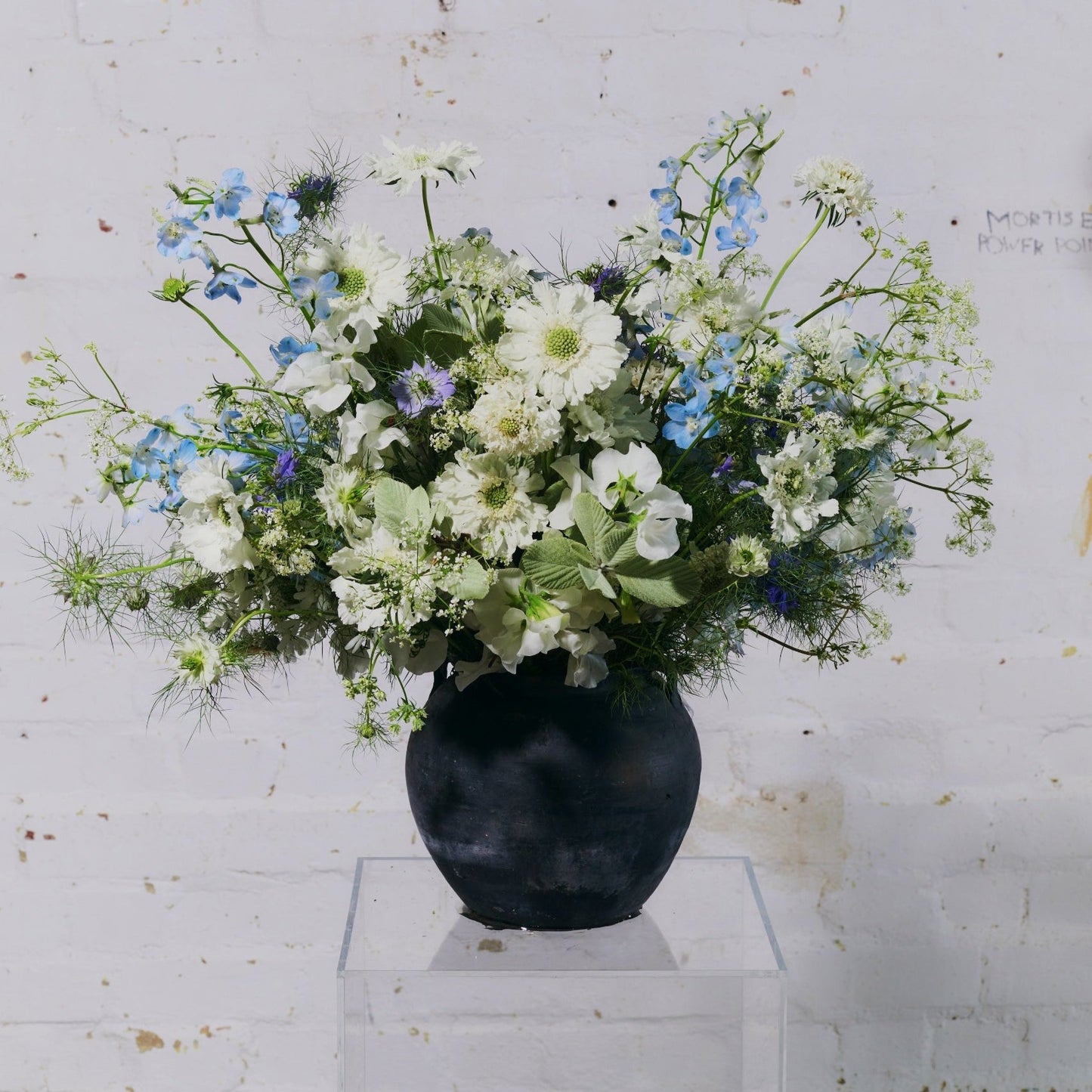 bouquet of green, white and blue flowers